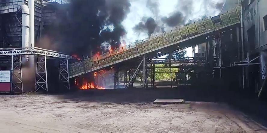 Fire on a conveyor belt transporting petroleum coke