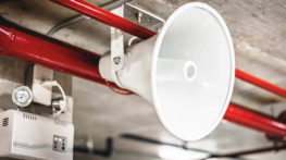 Fire alarm system for production spaces and staff facilities for a door manufacturer