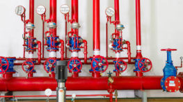 Fire detection and sprinklers control system for inclined coal conveyors