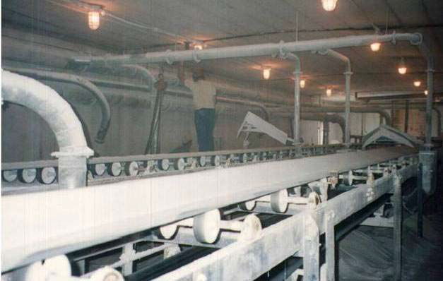 Archival photo of the conveyor prior to its enclosure