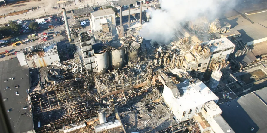 A sugar dust explosion in an enclosed conveyor caused by many years of neglect