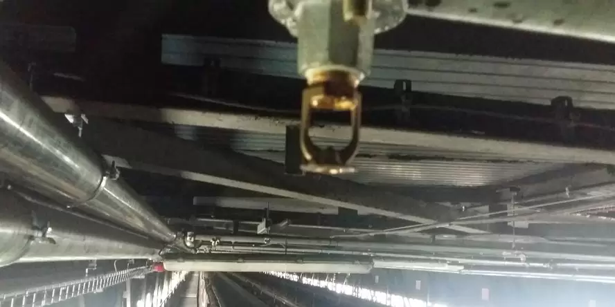 Sprinkler over an inclined bridge